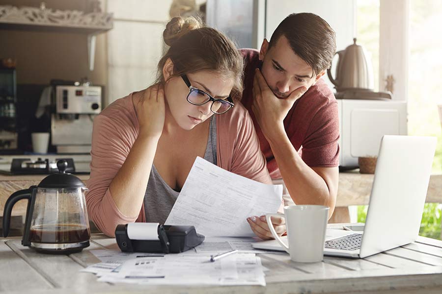 couple developing a plan to pay off their debt